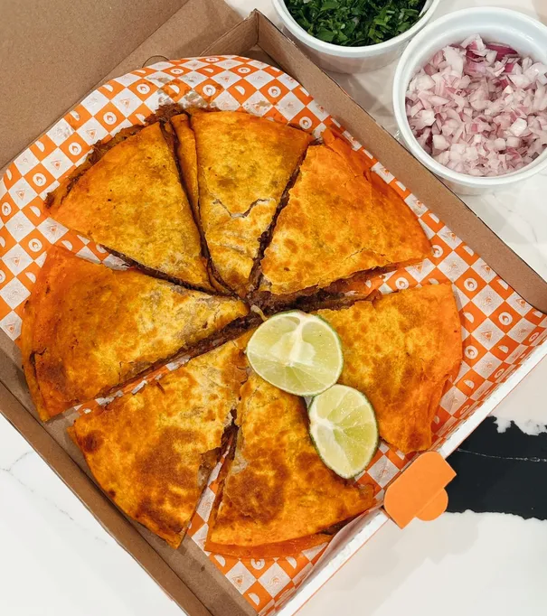 Pizzabirria, a unique fusion dish at The Birria Society.